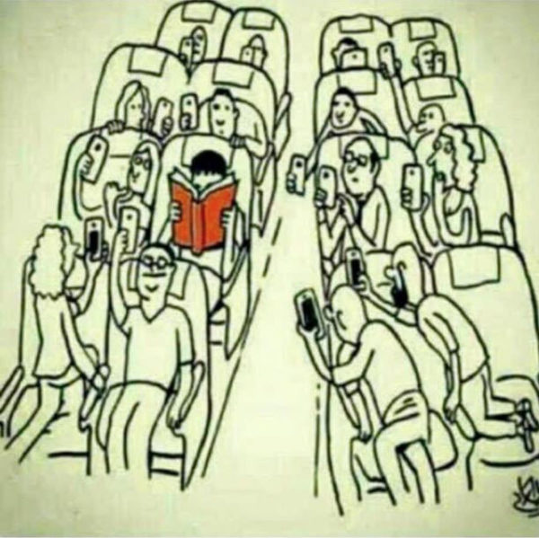 Reading real book on airplane