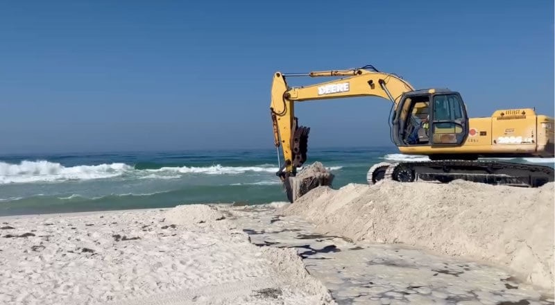 Excavator on the beach