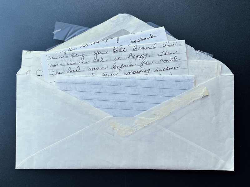 Envelope full of letters from a mother to a child