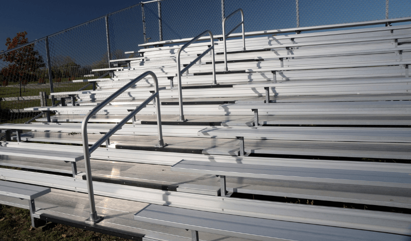 A set of empty bleachers at night