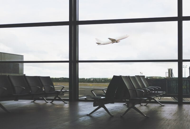 Empty airport terminal at night symbolizing slowing down and waiting