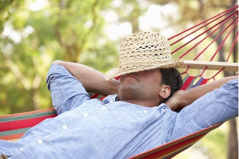 Man relaxing with closed eyes and unclenched jaw