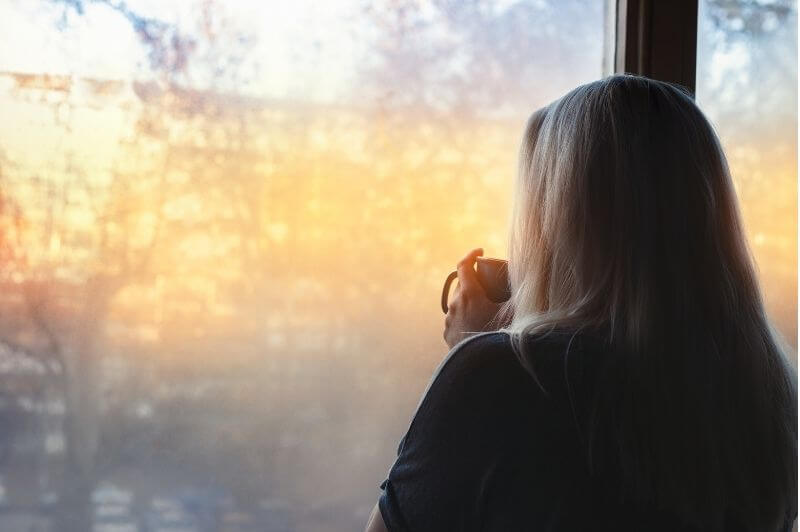 Woman in morning light to reset her body and mood